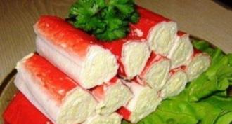 Crab sticks stuffed with cottage cheese and herbs With melted cheese and egg