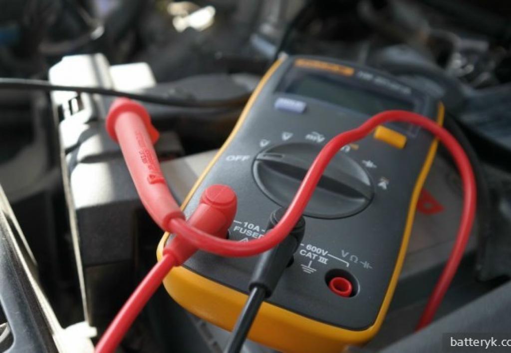 Checking a car battery with a multimeter
